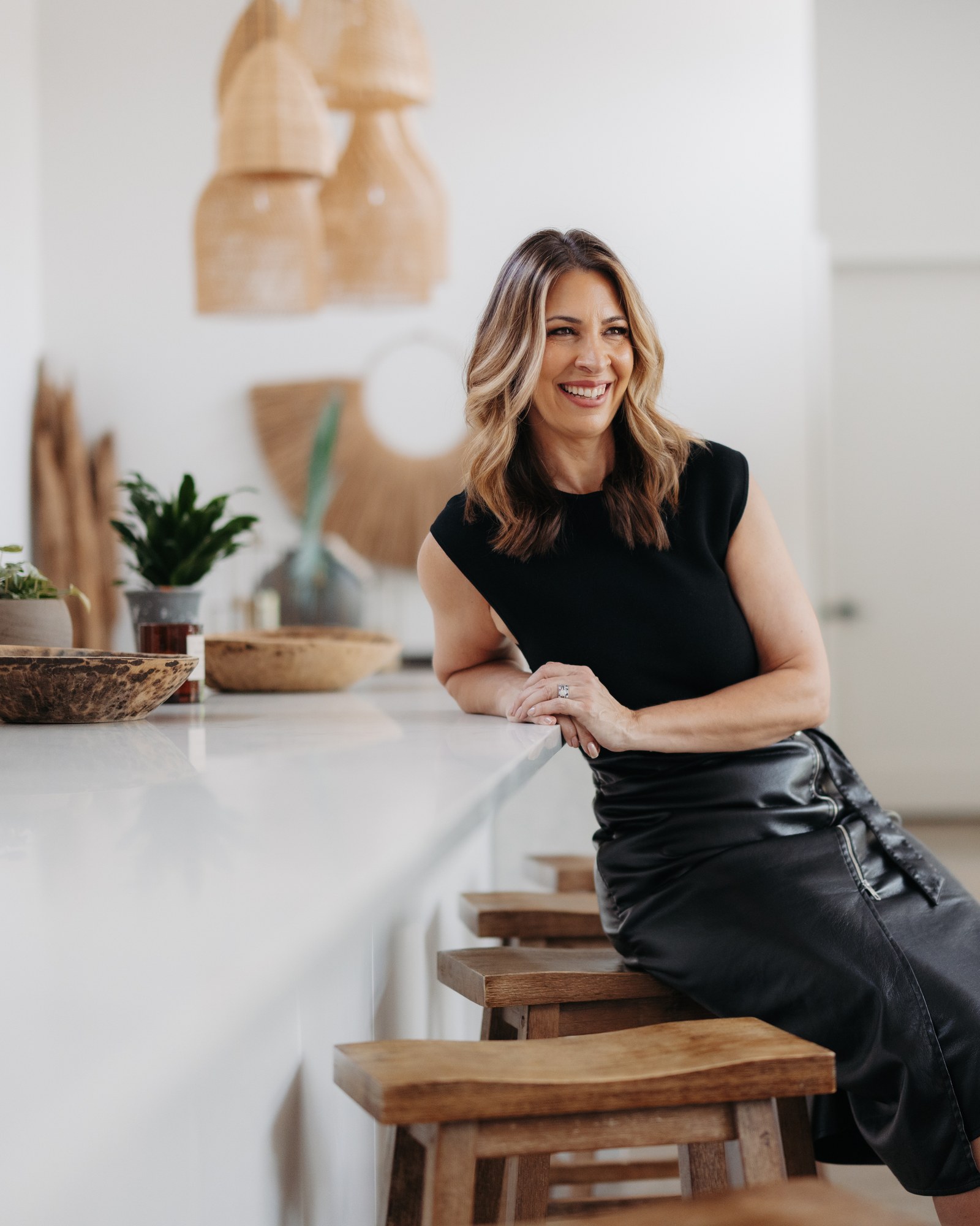 Elizabeth Riley seated at a kitchen island